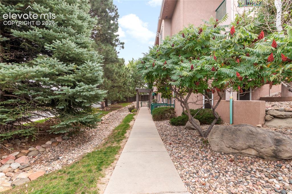 Image 40 of 45: Walkway from Parking to Ground Floor Unit