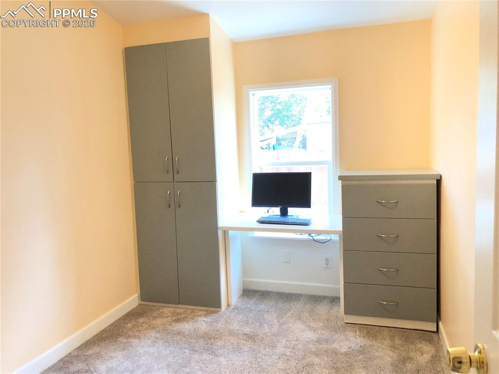 Image 17 of 30: Third bedroom / home office 