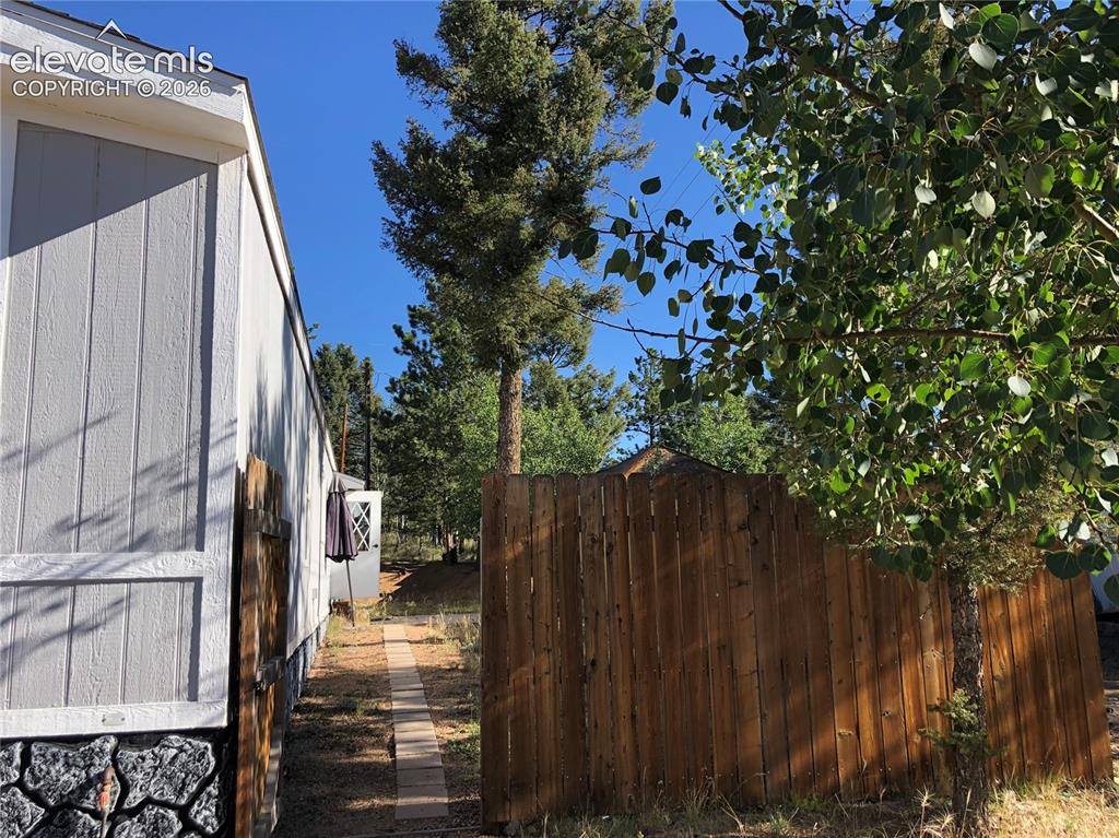 Image 17 of 25: Partially Fenced Yard ~ Aspen and Pine Trees ~ Sunny Location