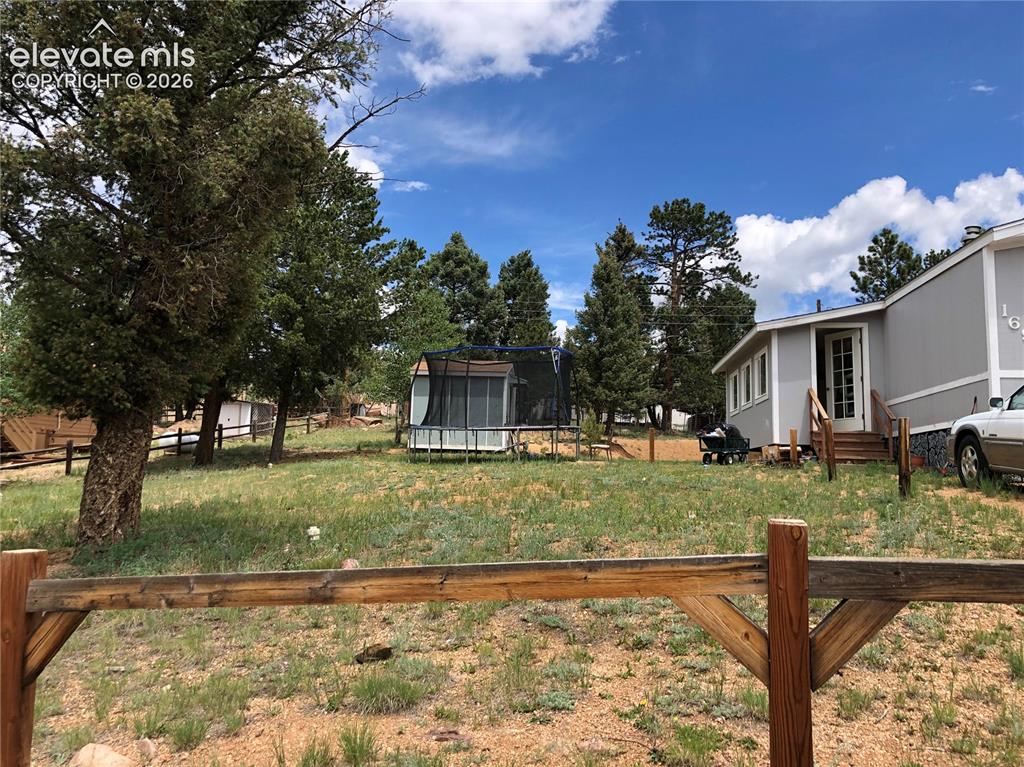 Image 2 of 25: 1/3 ACRE LOT! Private Location and Minutes to Woodland Park and Charis Bibl