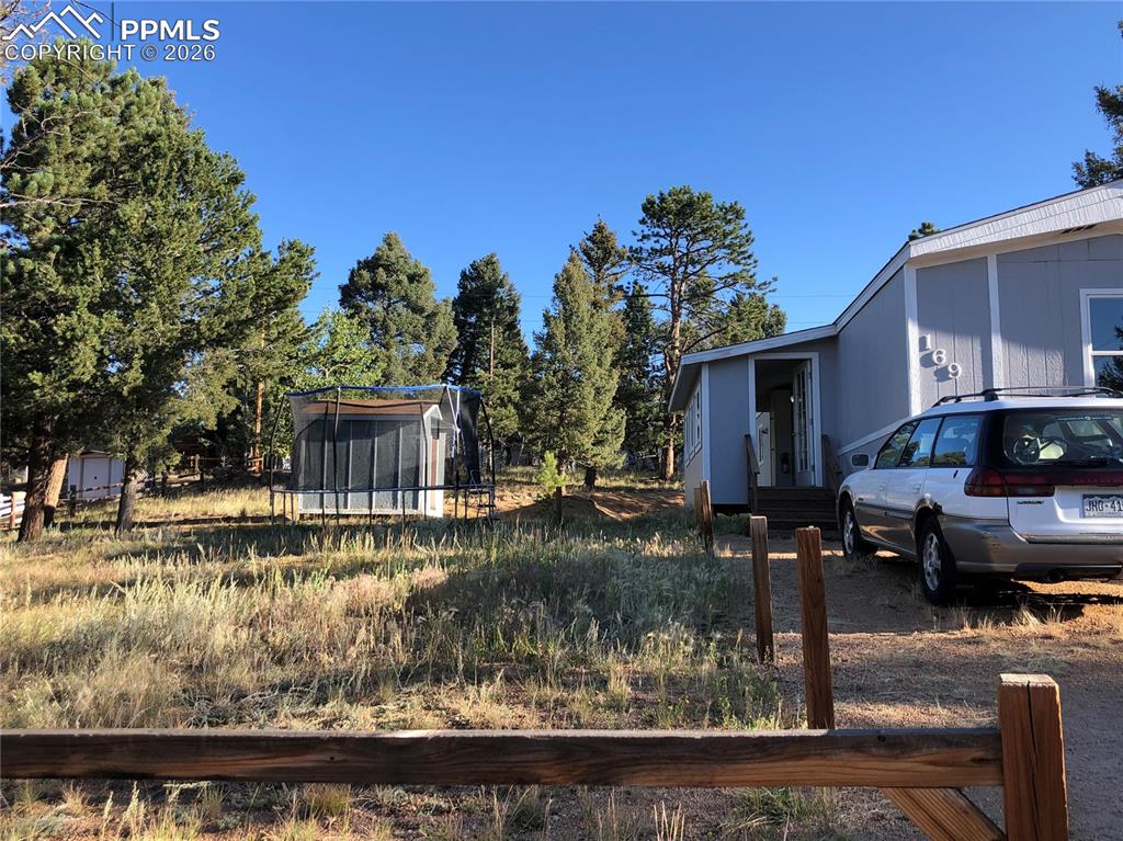 Image 22 of 30: Tall Pine and Aspen Trees Surround the Property