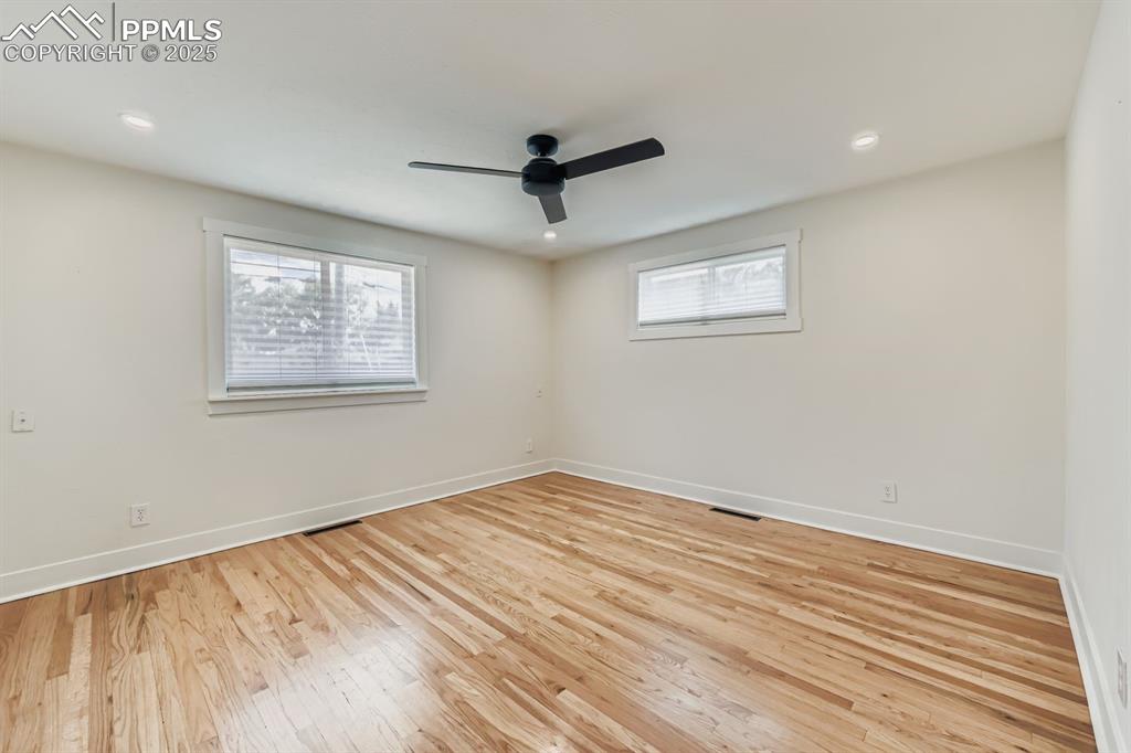Image 17 of 28: Unfurnished room with light wood-type flooring, recessed lighting, and ceil