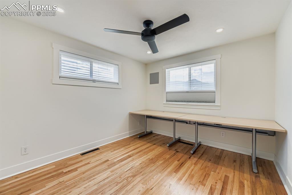 Image 19 of 28: Unfurnished office with plenty of natural light, light wood-style flooring,