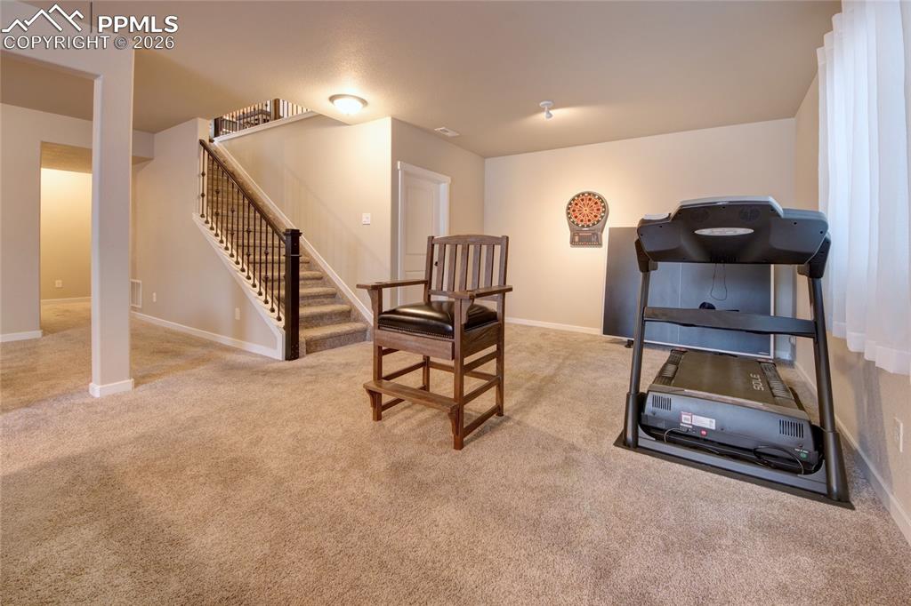 Image 21 of 36: Cast iron railing leads to basement family room
