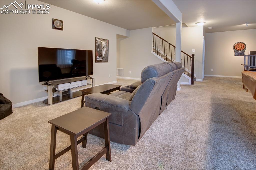 Image 24 of 36: Family room sectioned off for tv watching