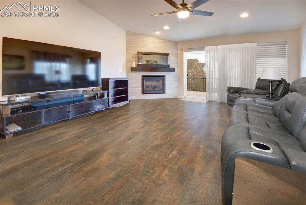 Image 7 of 36: Living room ceiling fan and LVT