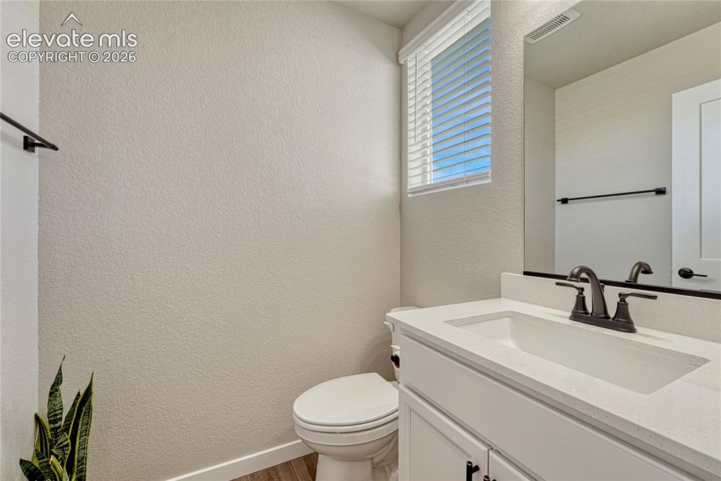 Image 11 of 30: Powder room on main floor. 