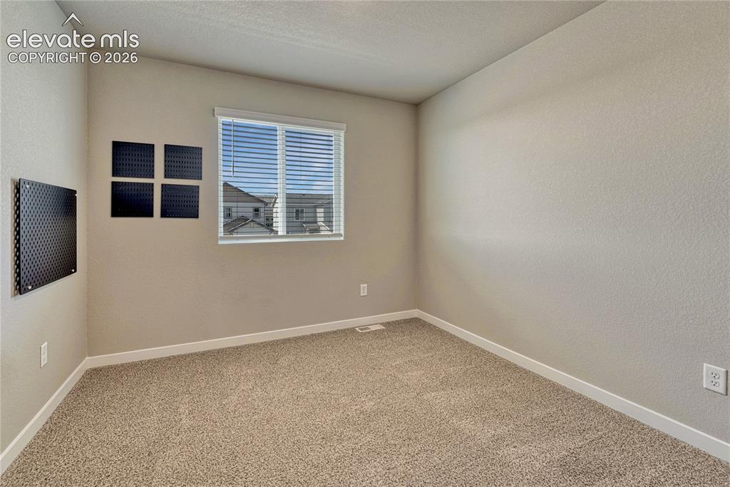 Image 26 of 30: Third of three additional bedrooms. 