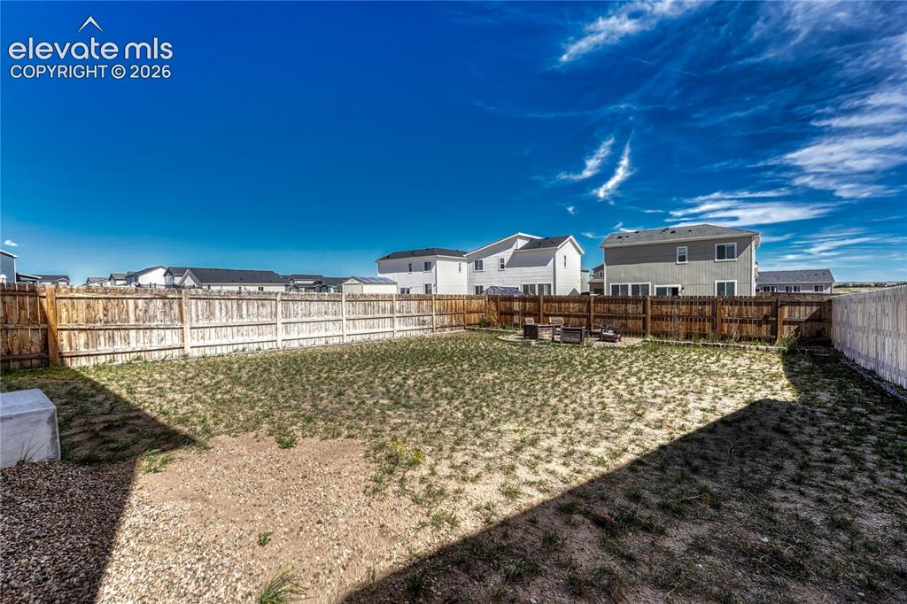 Image 28 of 30: Large, flat fenced yard.