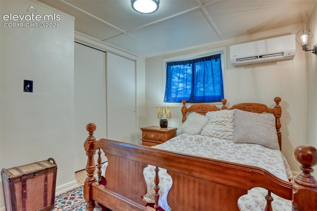 Image 21 of 47: Room featuring a window, built-in Lennox heater/air conditioning unit, and