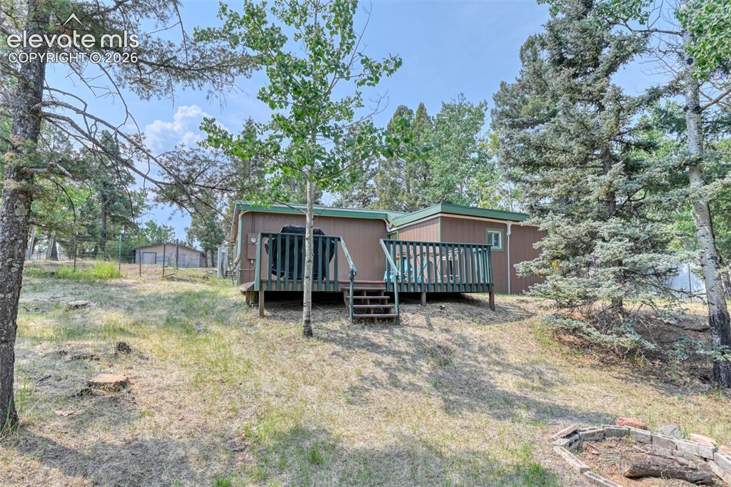 Image 35 of 47: Large deck to enjoy BBQ, conversation with a view, and maybe a hot tub some