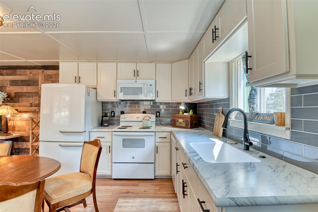 Image 6 of 47: Open kitchen allows for plenty of room to create great family meals.