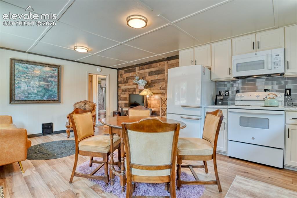 Image 9 of 47: Open-concept living area. Great place for family meals, boardgames, and go