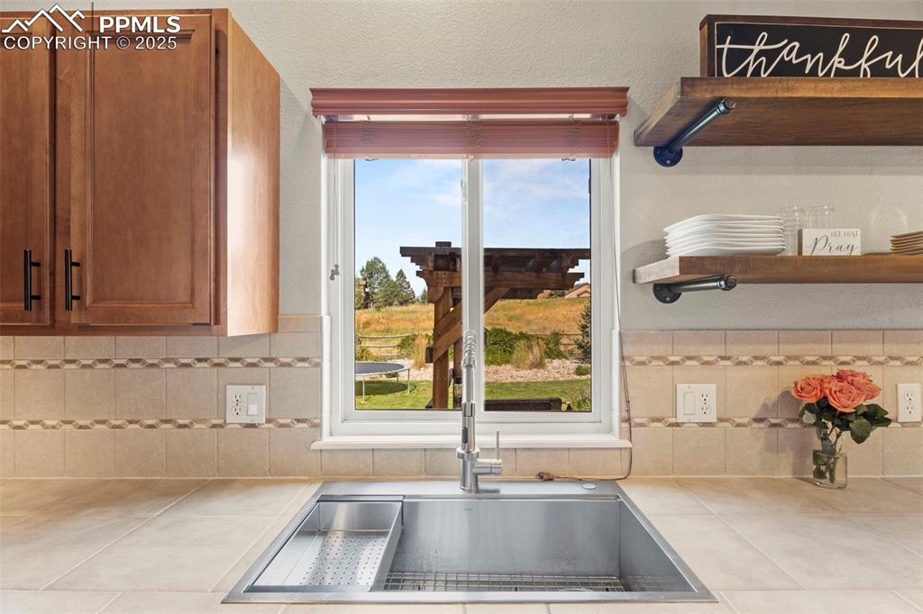 Image 14 of 41: Deep well stainless sink with removable vegetable washing bin and cutting b