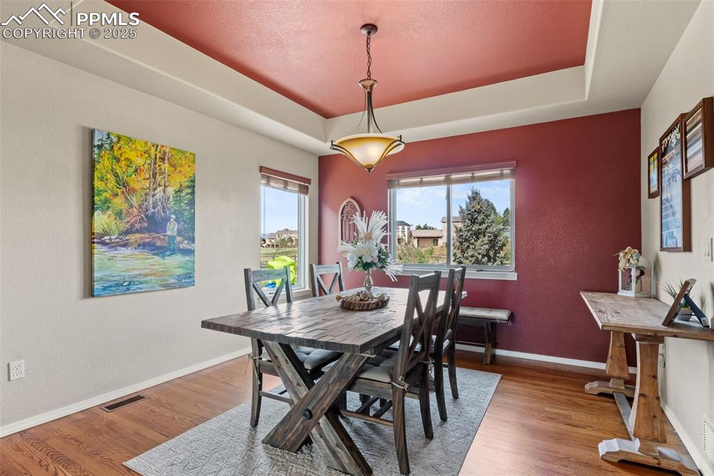 Image 9 of 41: Formal dining room with tray ceiling 