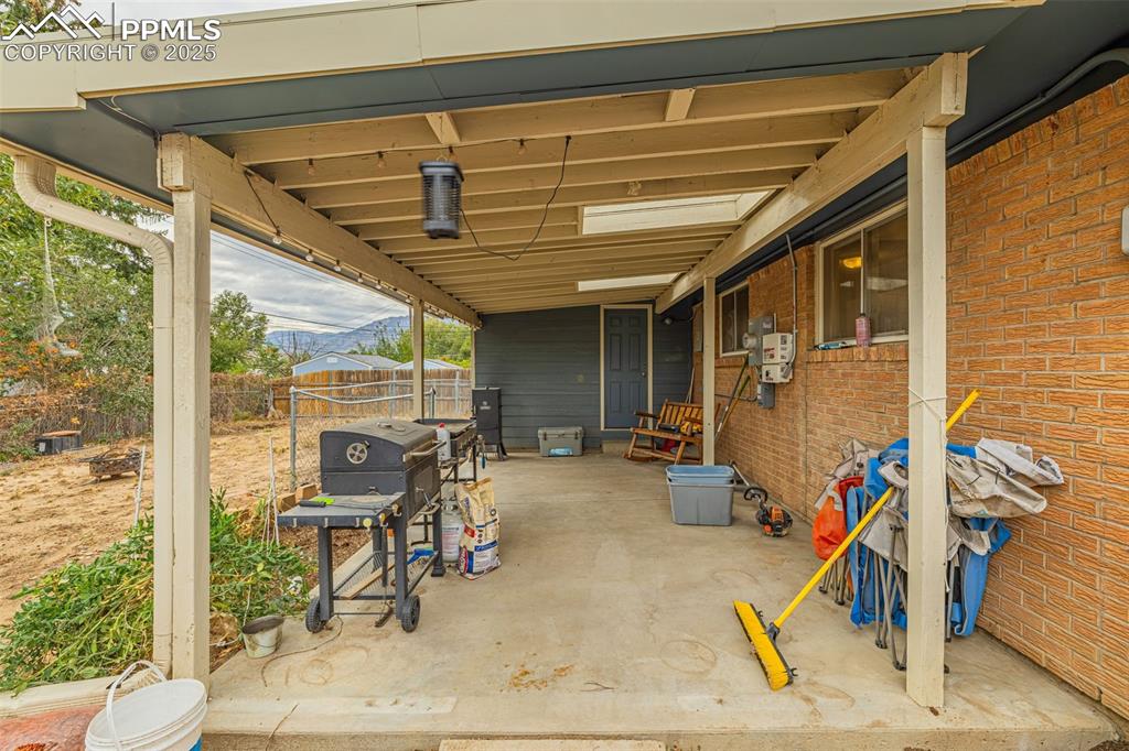 Image 27 of 37: View of patio / terrace featuring area for grilling and a mountain view