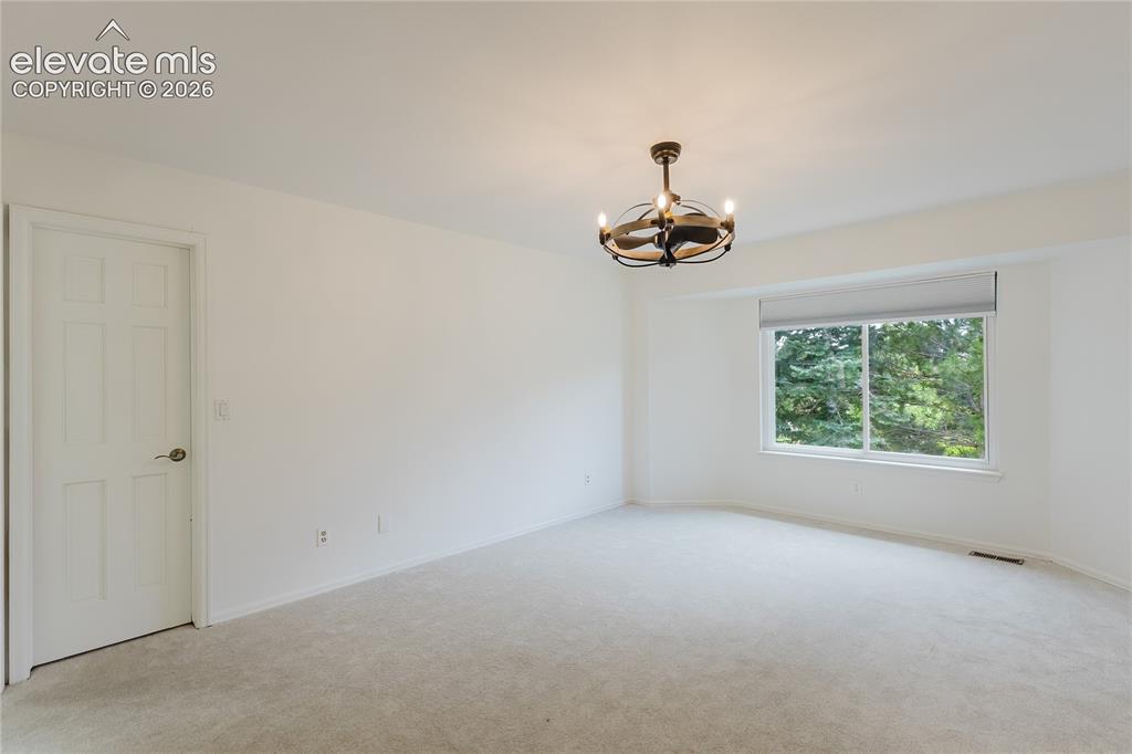 Image 11 of 34: Primary suite on main level