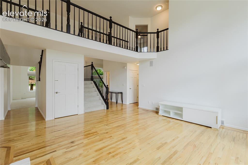 Image 14 of 34: Great room with tall ceilings and modern feel