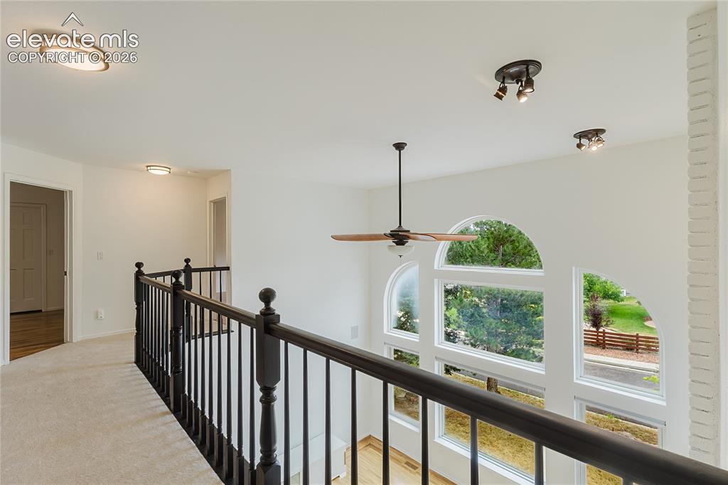 Image 15 of 34: Balcony to bedrooms overlooks great room