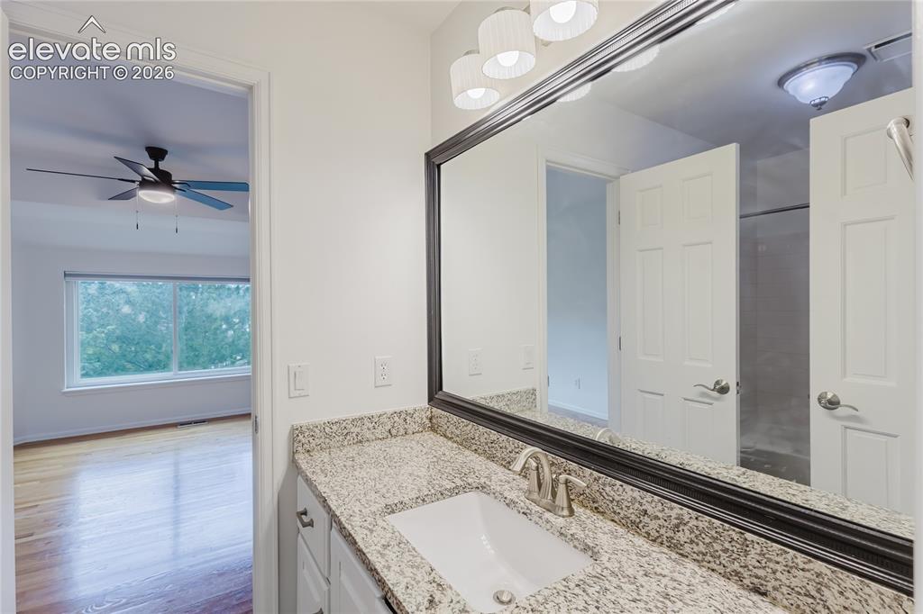 Image 18 of 34: Granite countertops in jack-and-jill bathroom