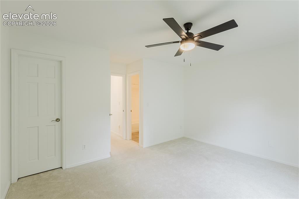 Image 19 of 34: 3rd bedroom upstairs is carpeted with attached private bathroom