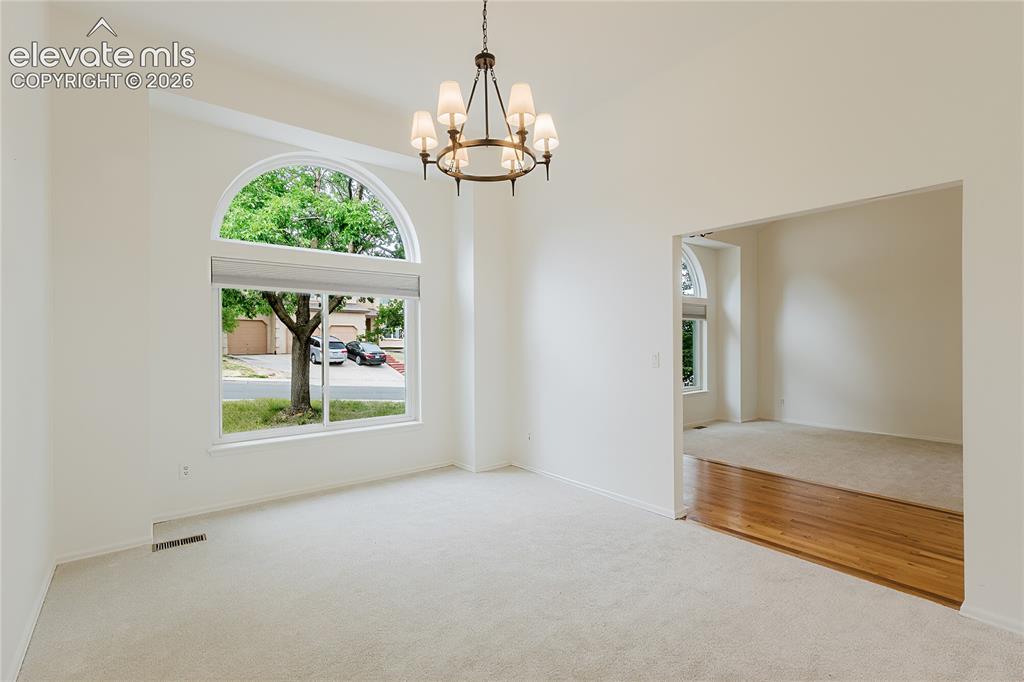 Image 5 of 34: Formal dining area on other side of entry door