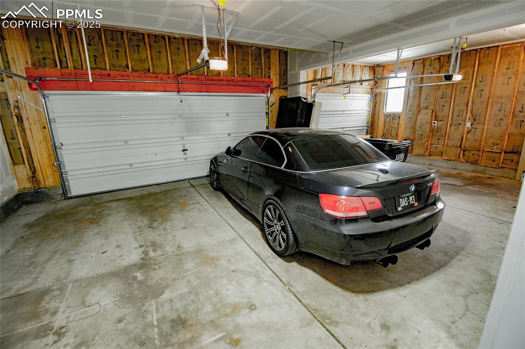 Image 23 of 25: Garage with fully insulated