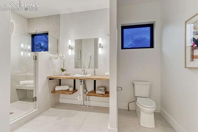 Image 11 of 26: Full bath with a stall shower and vanity