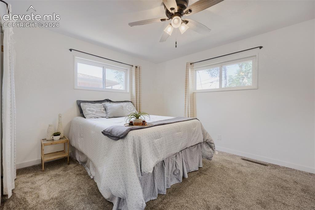 Image 10 of 20: Primary bedroom with attached bath