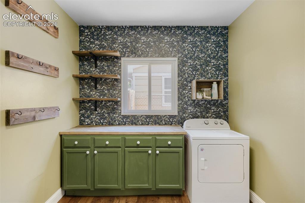 Image 15 of 20: Laundry/mud room/drop zone from garage