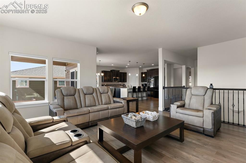 Image 24 of 46: Living room with light wood-type flooring