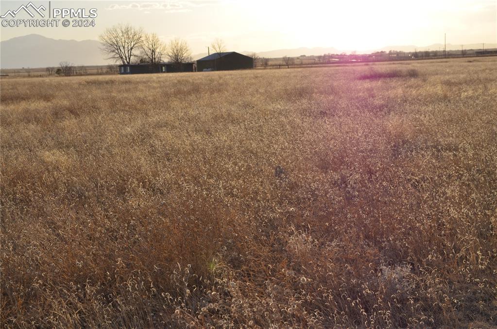 Image 14 of 17: View of yard with a rural view and a mountain view