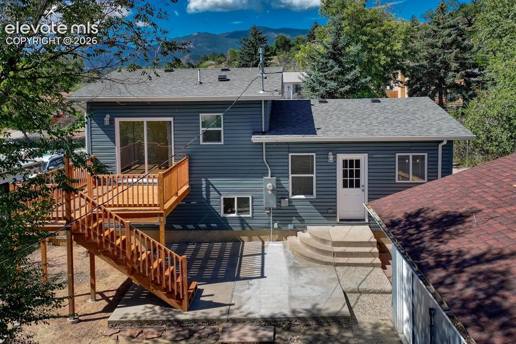 Image 4 of 50: Back deck and patio!