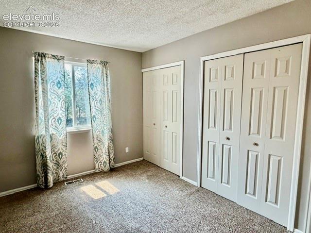 Image 18 of 27: 2nd upstairs bedroom with two closets 