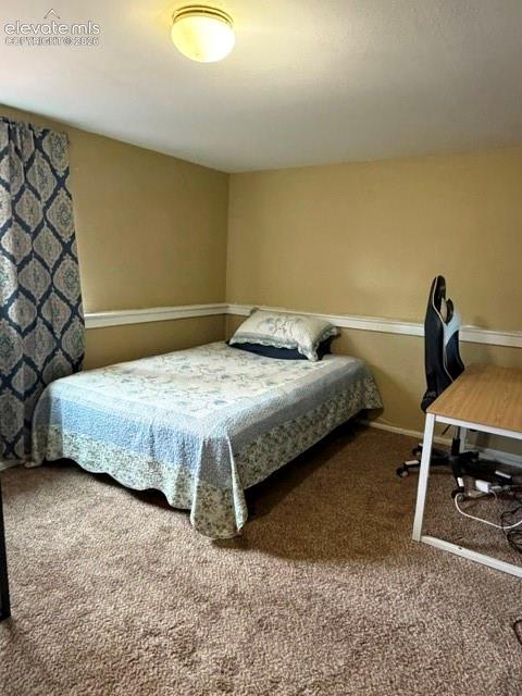 Image 20 of 27: Lower level non conforming bedroom, no closet.