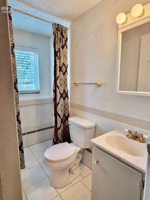 Image 24 of 27: Lower level 1/2 bath with toilet and sink. no shower.