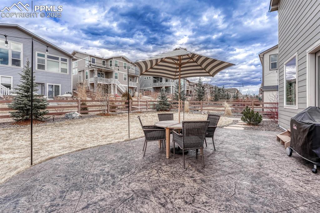 Image 38 of 44: View of patio / terrace with outdoor dining area, fence, and a grill