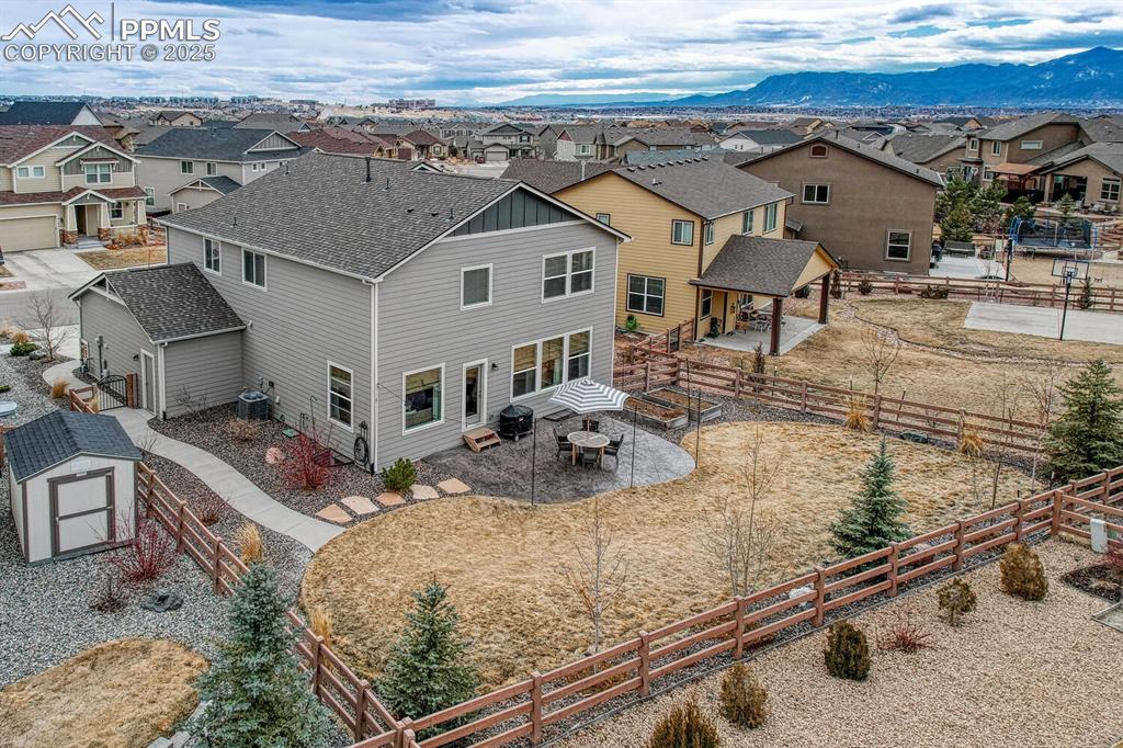Image 39 of 44: Drone / aerial view featuring a residential view and a mountain view