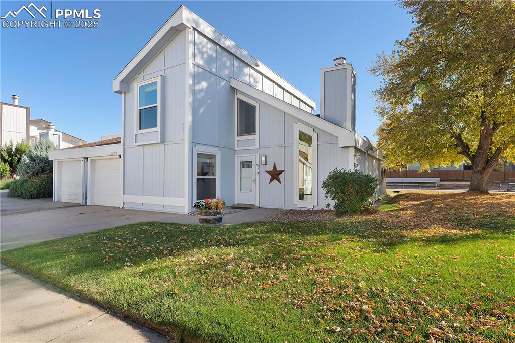 Image 2 of 33: Contemporary house featuring a front lawn and 1 car garage