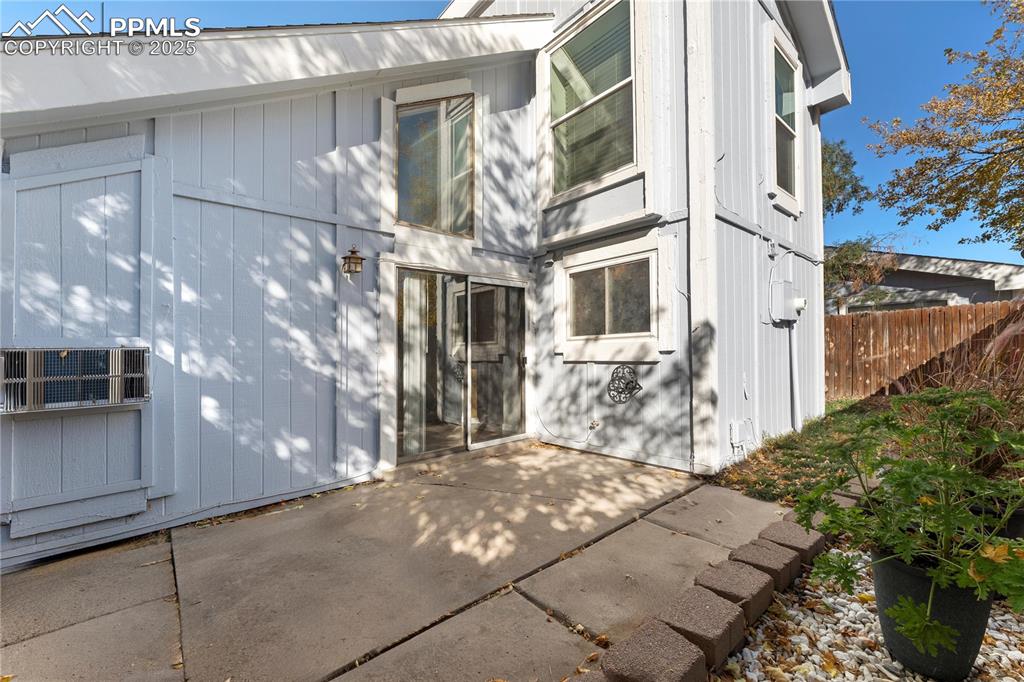 Image 26 of 33: View of exterior entry with a patio area
