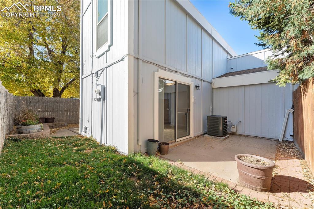 Image 27 of 33: Rear view of property with a fenced backyard and a patio
