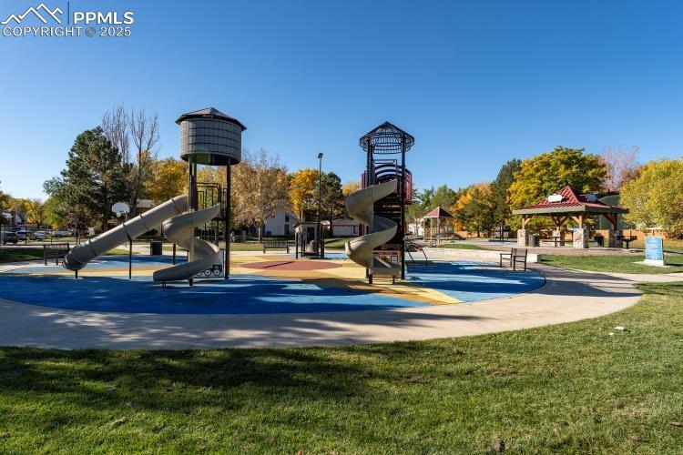 Image 33 of 33: Community playground featuring a gazebo, a patio, and a lawn