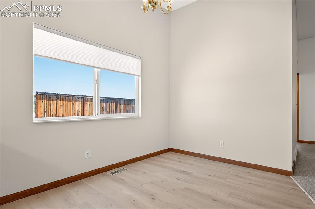 Image 13 of 23: Vaulted dining area.
