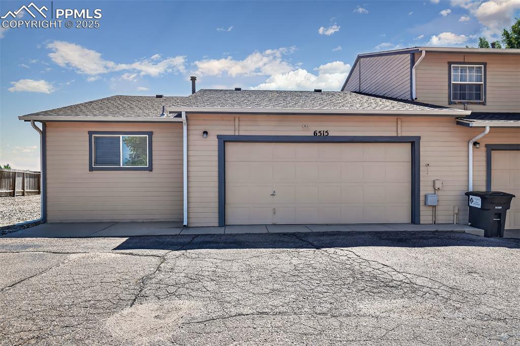 Image 22 of 23: Oversized two-car finished garage with opener.