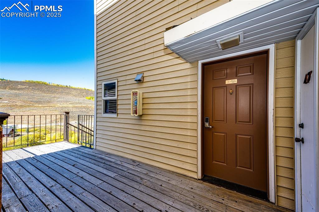 Image 2 of 42: Property entrance with a deck