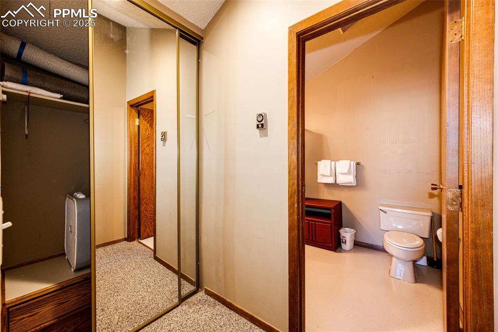 Image 28 of 42: Hallway featuring baseboards