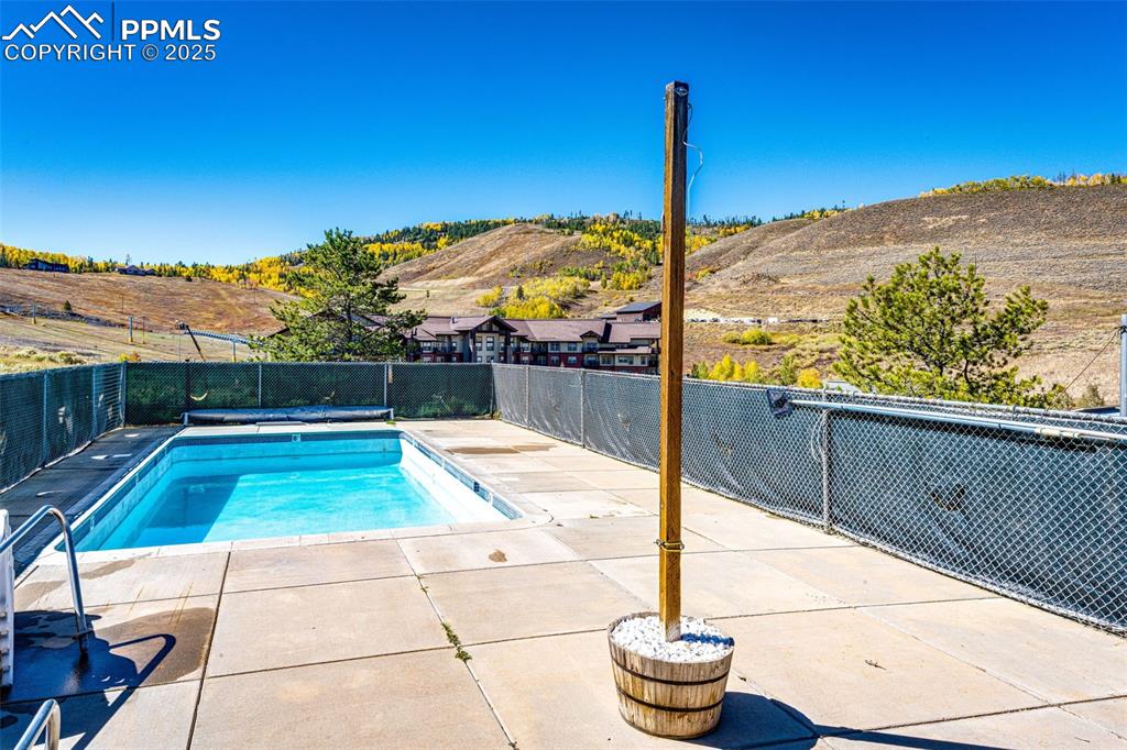 Image 37 of 42: View of pool featuring a fenced backyard and a patio