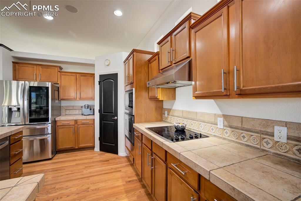 Image 15 of 50: Corner pantry in the kitchen (one of two!)