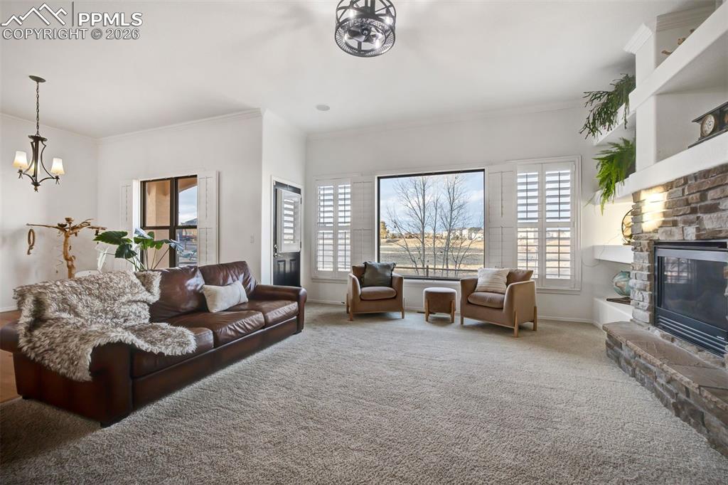 Image 20 of 50: Walk out to the patio from the living room 