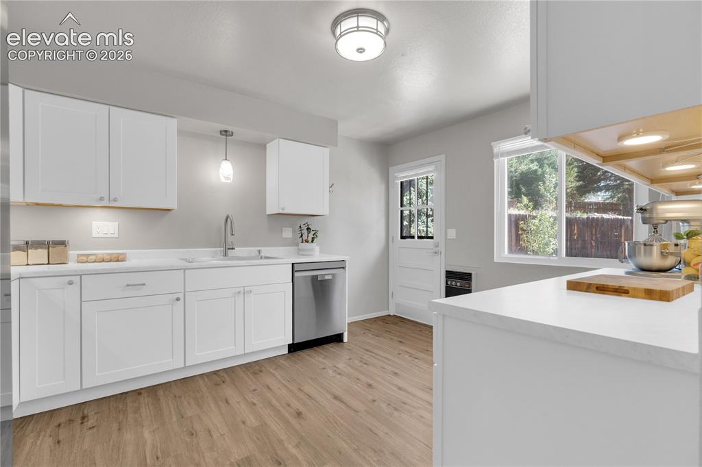 Image 11 of 30: Updated Kitchen with backyard access